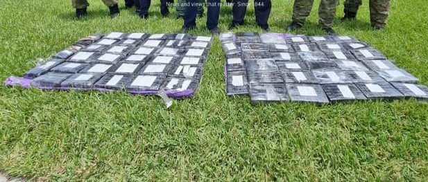 Twenty-one Chinese nationals were taken into police custody this morning after officers discovered 68 kilos of cocaine, worth an estimated $1.3 million, on a cargo vessel that was moored at the Nassau Container Port.  Photo: Jasper Ward